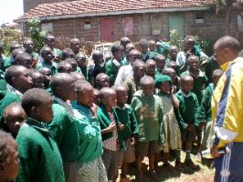 Henry giving motivational talk to the student of Kiragari primary school